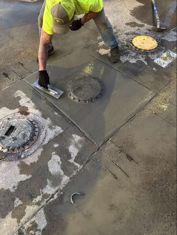 man laying concrete over underground fuel storage tank