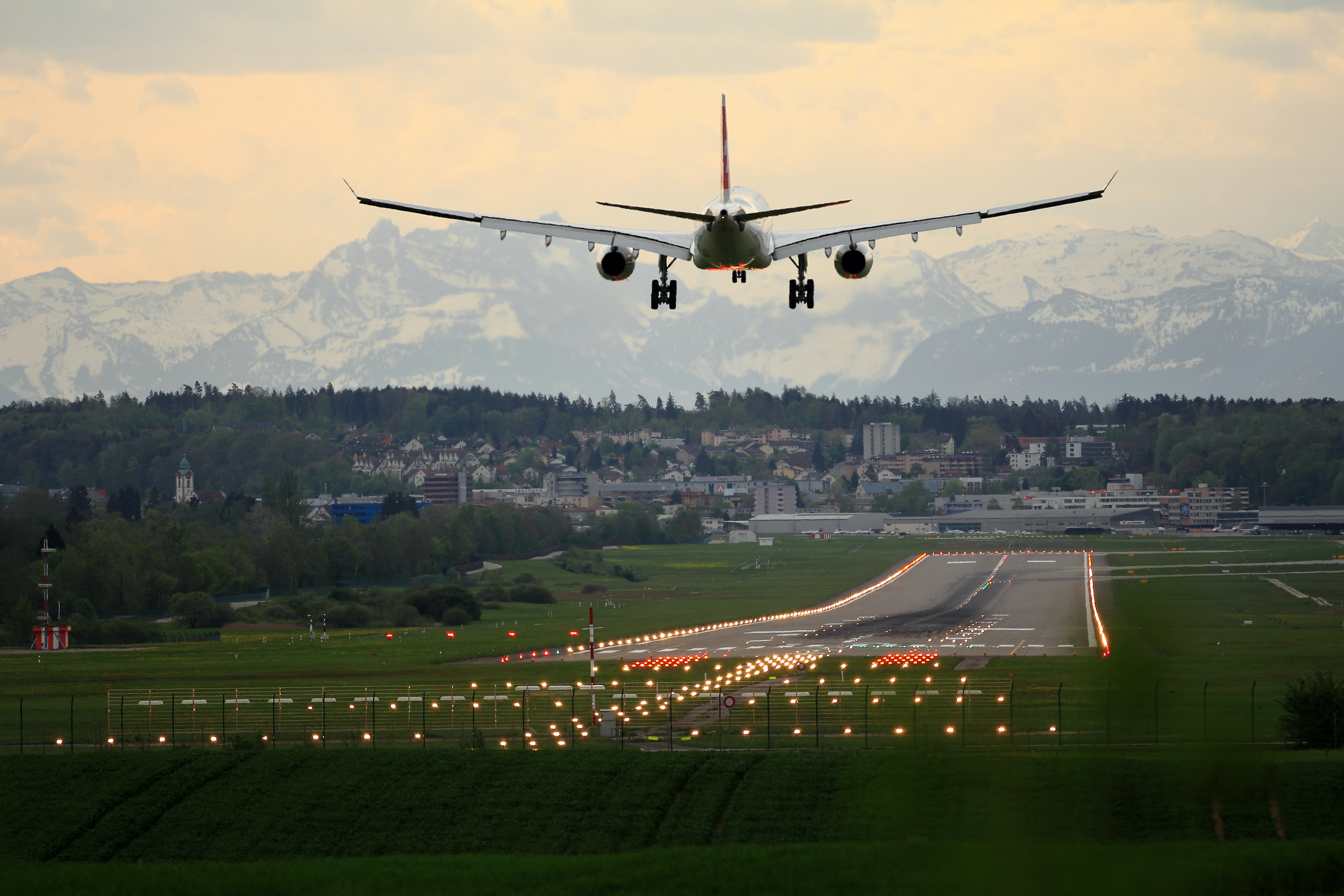 air plane in landing on runway at small airport